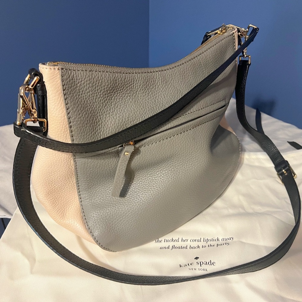 NWOT $300 Kate Spade Gray and Tan Leather Purse with black crossbody strap.